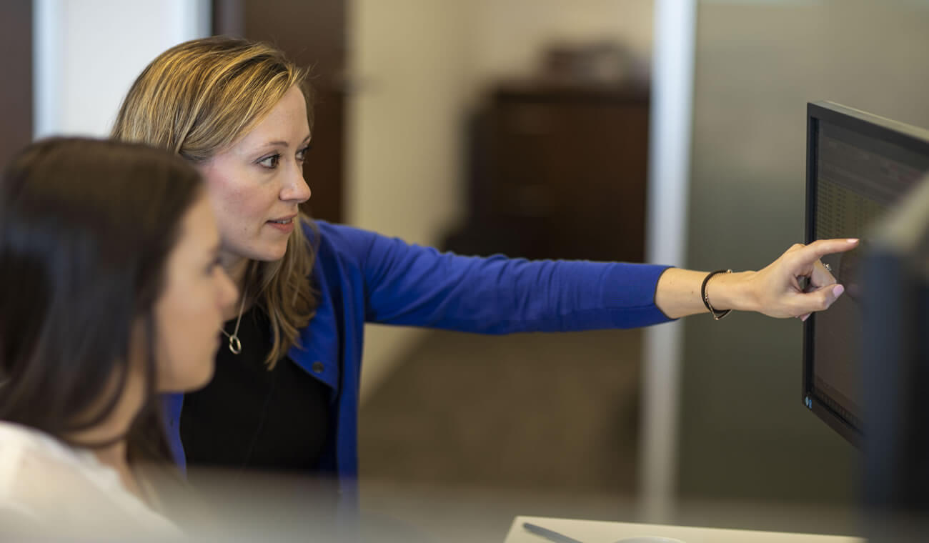 Two women reviewing a computer screen